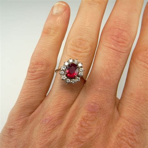 diamond surrounded by rubies ring.